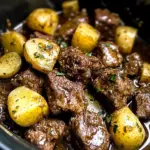 crockpot garlic butter beef bites with potatoes